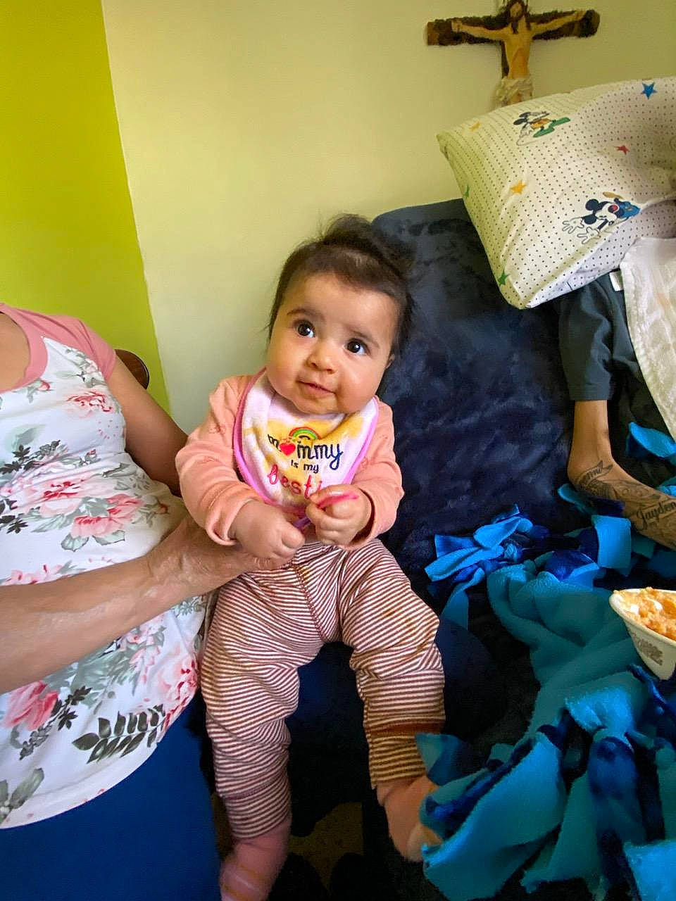 Celina joined the competition — help win amazing prizes! baby, baby_toddler_clothing, child, comfort, cross, event, fun, happy, leisure, linens, person, pillow, play, religious_item, room, sitting, symbol, textile, throw_pillow, toddler