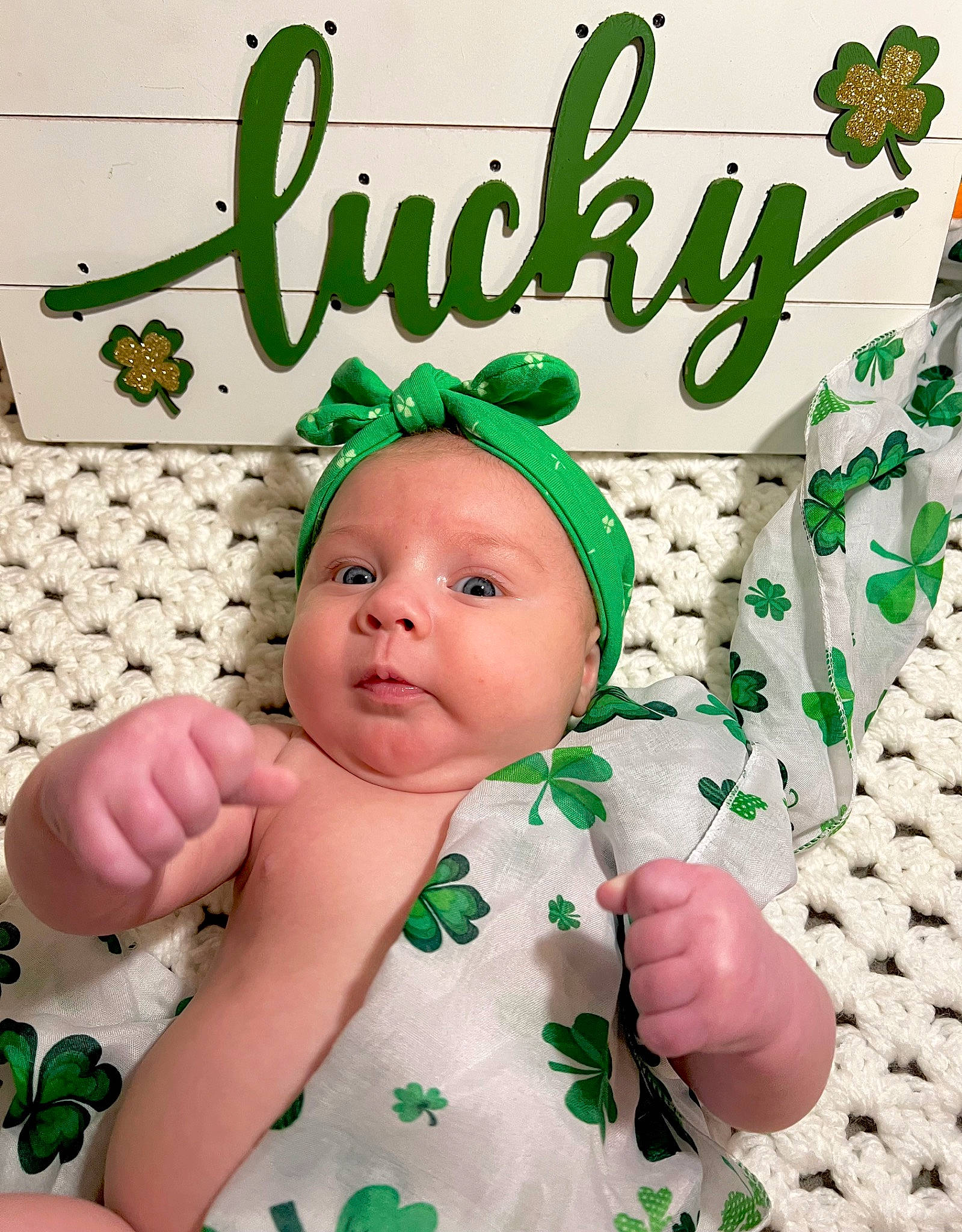 Saylor is registered to the contest to win money with this photo: baby, baby_toddler_clothing, cheek, child, facial_expression, finger, font, gesture, grass, green, happy, hat, headwear, linens, pattern, people_in_nature, person, skin, sleeve, textile