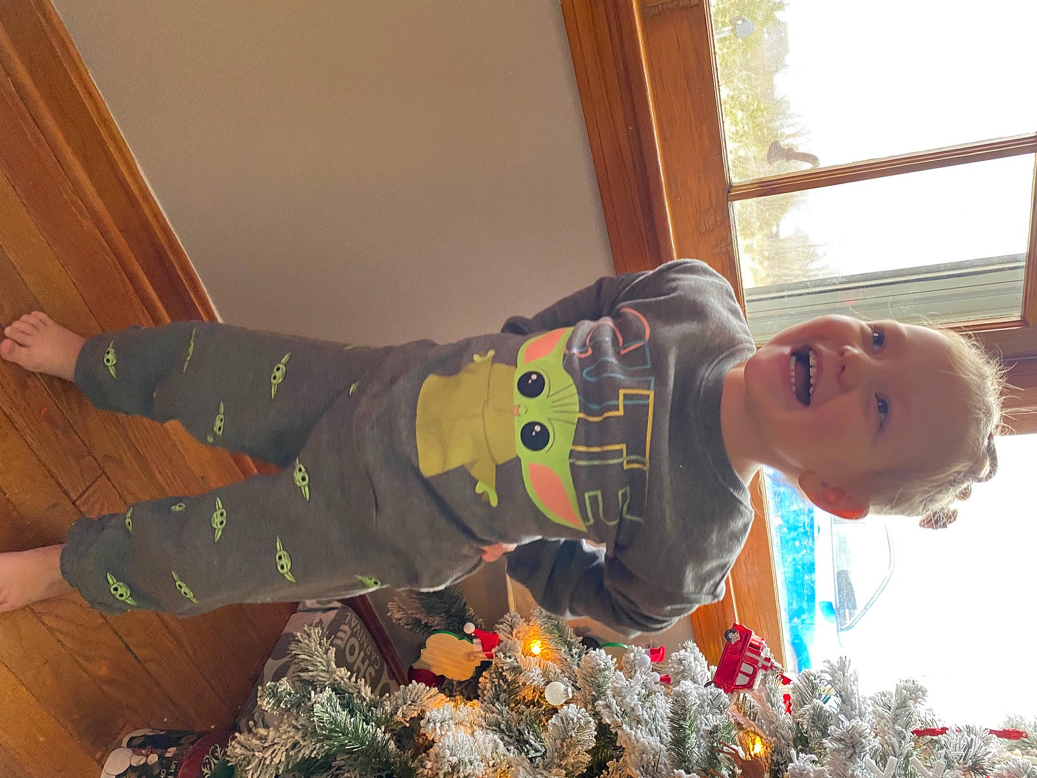 Blake-lynn is registered to the contest to win money with this photo: baby, child, christmas, christmas_eve, event, flooring, fun, happy, holiday, leisure, person, play, room, smile, toddler, tree, window, winter