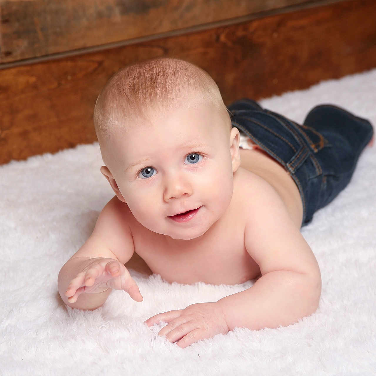Grayson is registered to the contest to win money with this photo: arm, baby, babycrawling, bodypart, clothing, crawling, face, finger, hand, happy, head, jeans, newborn, pants, person, photography, portrait, sitting, smile, wood