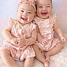 adorable, babies, baby_photography, blanket, children, cuddling, family, flower_headbands, fluffy_blanket, happy, indoor, infants, joyful, matching_outfits, pink, portrait, sitting, smiling, soft_lighting, twins
