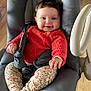 Jeanne participe au concours pour gagner de l'argent avec cette photo : baby, baby_rocker, child, clothing, comfort, cozy, cute, face, floral_pants, happy, home, indoor, infant, person, portrait, seatbelt, smiling, socks, sweater, wooden_floor