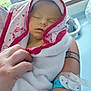 newborn, baby, blanket, hospital, arm, person, sleeping, wrapped, tattoo, wristband, indoor, closeup, soft, peaceful, infant, human, skin, holding, quiet, resting