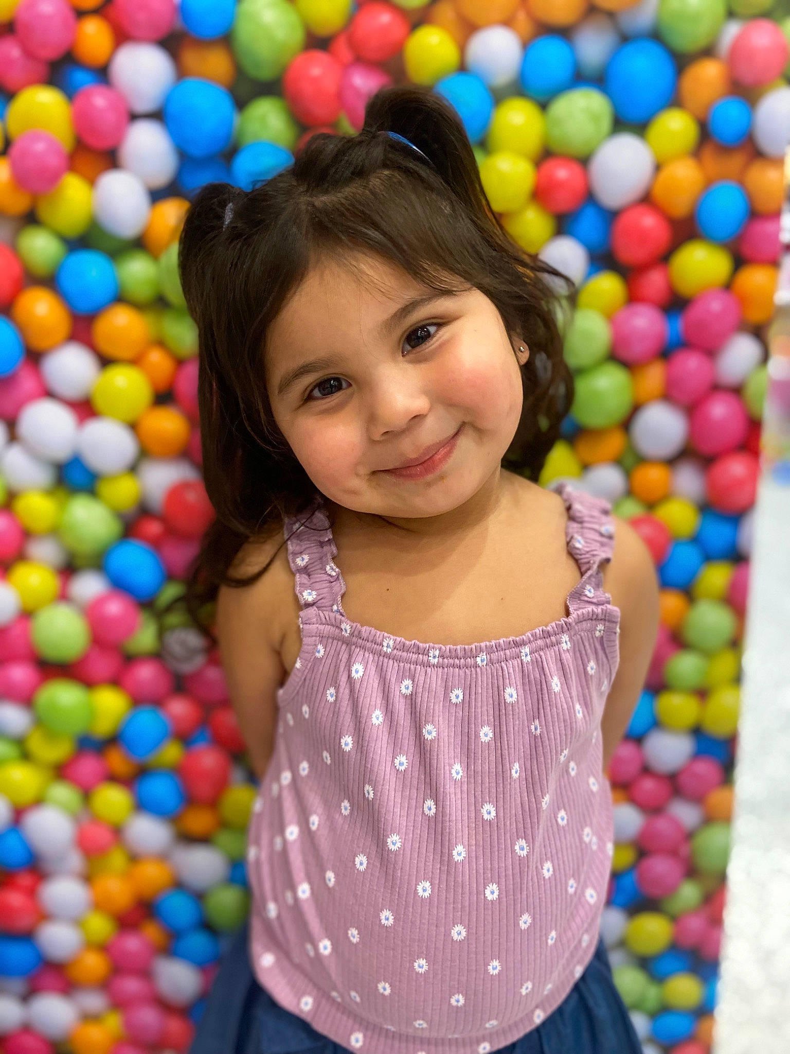 Flora is registered to the contest to win money with this photo: baby_toddler_clothing, ball_pit, beauty, child, event, facial_expression, fun, green, happy, joy, leisure, people, person, photograph, play, playground, recreation, sleeve, smile, snapshot