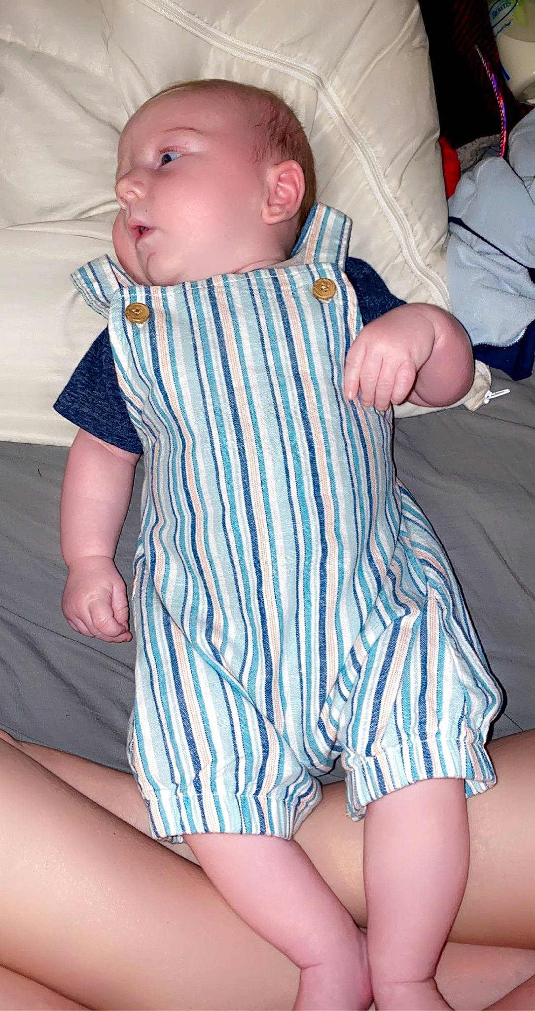 Rowin is registered to the contest to win money with this photo: azure, baby, baby_toddler_clothing, cheek, collar, comfort, eye, face, finger, head, iris, joint, organ, pattern, person, pink, skin, sleeve, textile, toddler