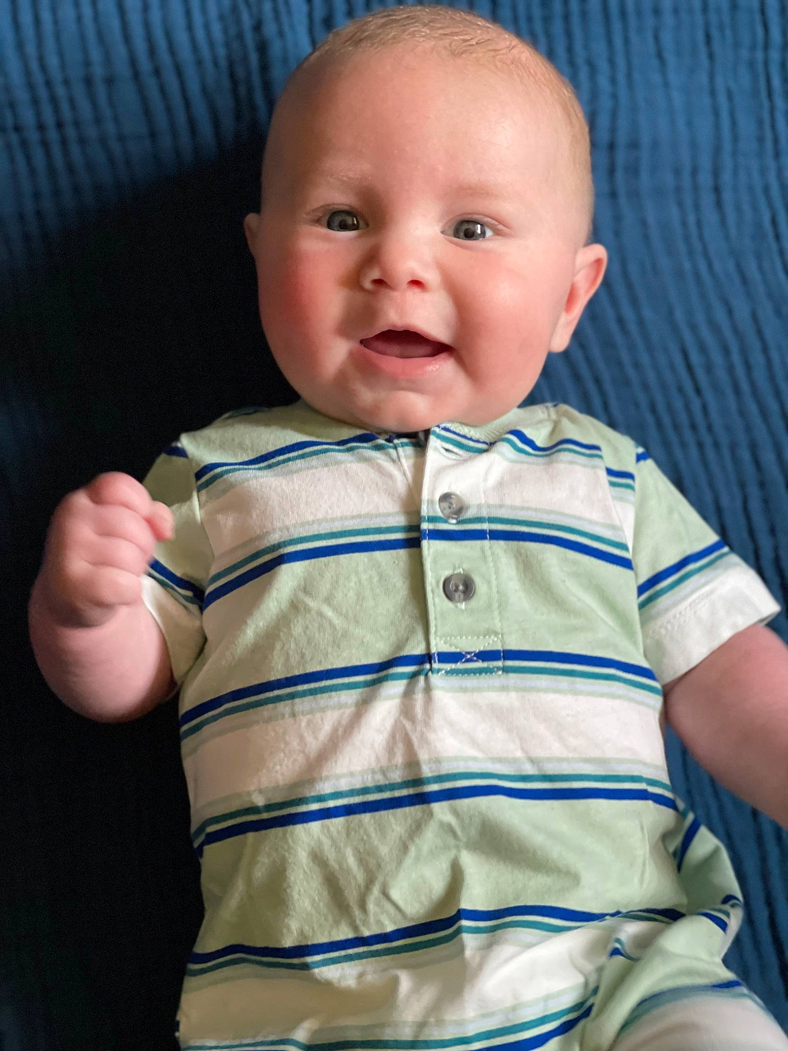 Hudson is registered to the contest to win money with this photo: baby, baby_toddler_clothing, cheek, child, chin, collar, comfort, eye, eyebrow, gesture, iris, mouth, nose, pattern, person, product, skin, sleeve, smile, t_shirt