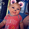 baby, background, blue_eyes, child, cute, digital_filter, ears, face, filter, flag, happy, headband, indoors, nose, person, pink, sitting, smile, tattoo, tshirt
