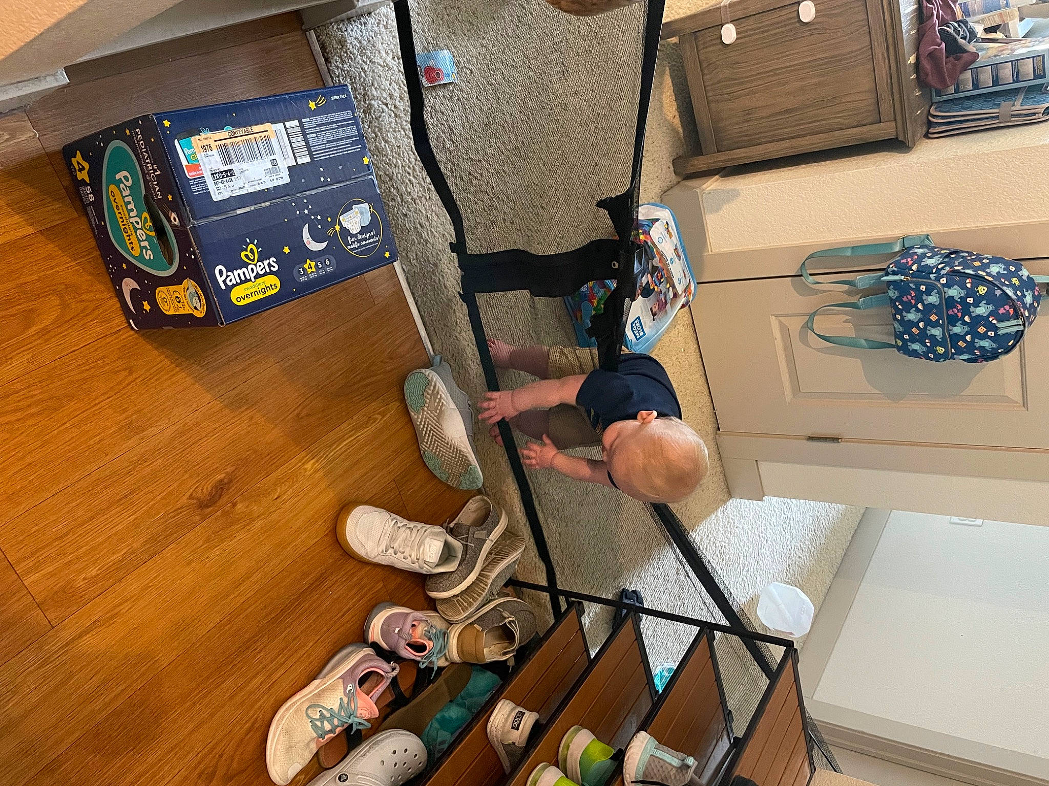 Layton is registered to the contest to win money with this photo: audio_equipment, bag, chair, computer_hardware, design, electrical_wiring, electronic_device, fashion_accessory, flooring, foot, hardwood, machine, musical_instrument_accessory, person, room, shelf, technology, varnish, wood, wood_flooring