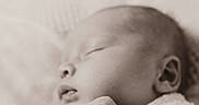 Kolter is registered to the contest to win money with this photo: newborn, baby, sleeping, blanket, wrapped, peaceful, closeup, soft_texture, infant, portrait, monochrome, sepia, cute, hand, face, resting, calm, cozy, child, tender