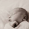 newborn, baby, sleeping, blanket, wrapped, peaceful, closeup, soft_texture, infant, portrait, monochrome, sepia, cute, hand, face, resting, calm, cozy, child, tender