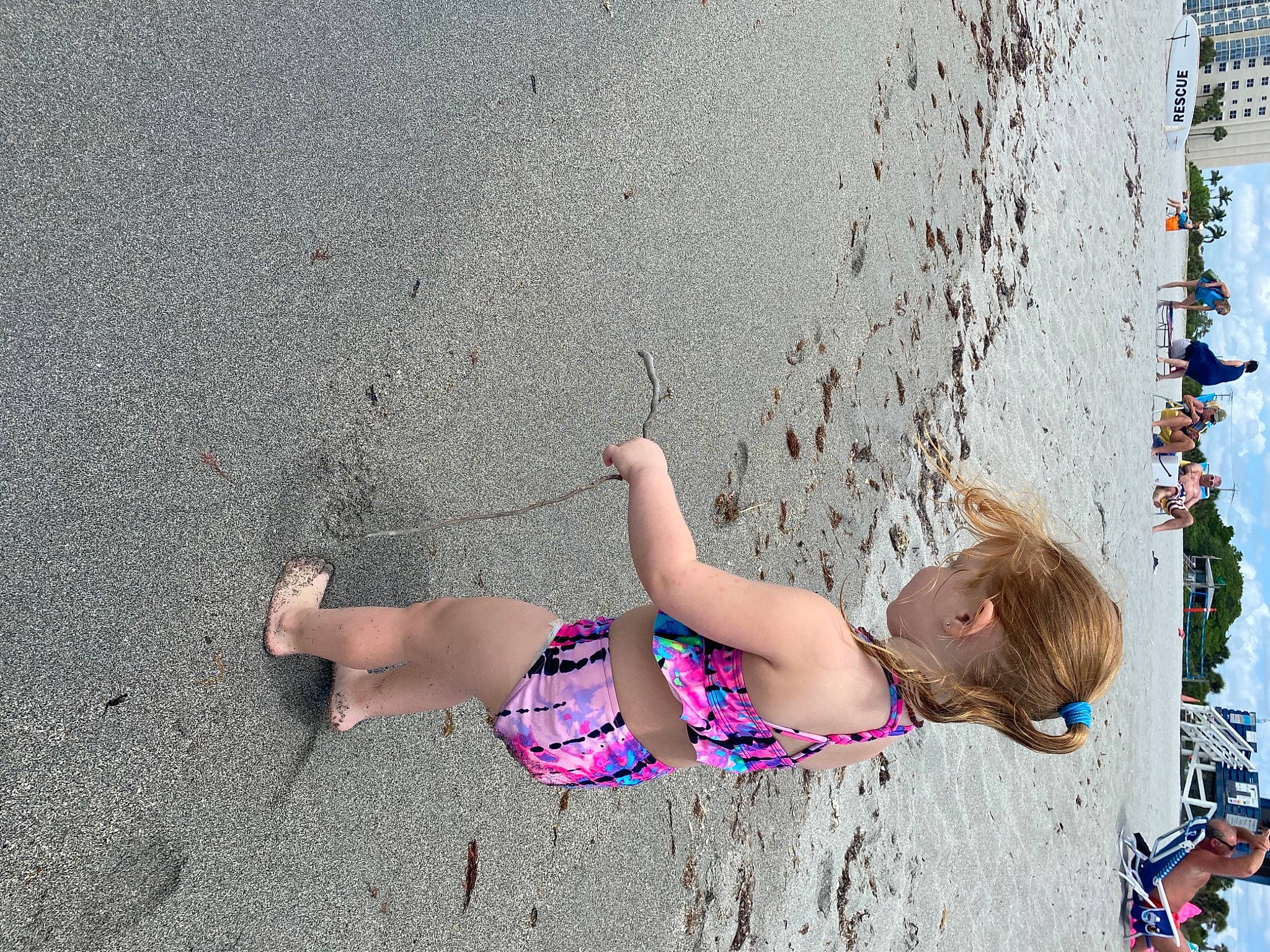 Macayla is registered to the contest to win money with this photo: azure, barefoot, beach, body_of_water, fun, happy, human, human_body, joint, leg, leisure, line, people_in_nature, person, public_space, recreation, summer, thigh, toddler, wall