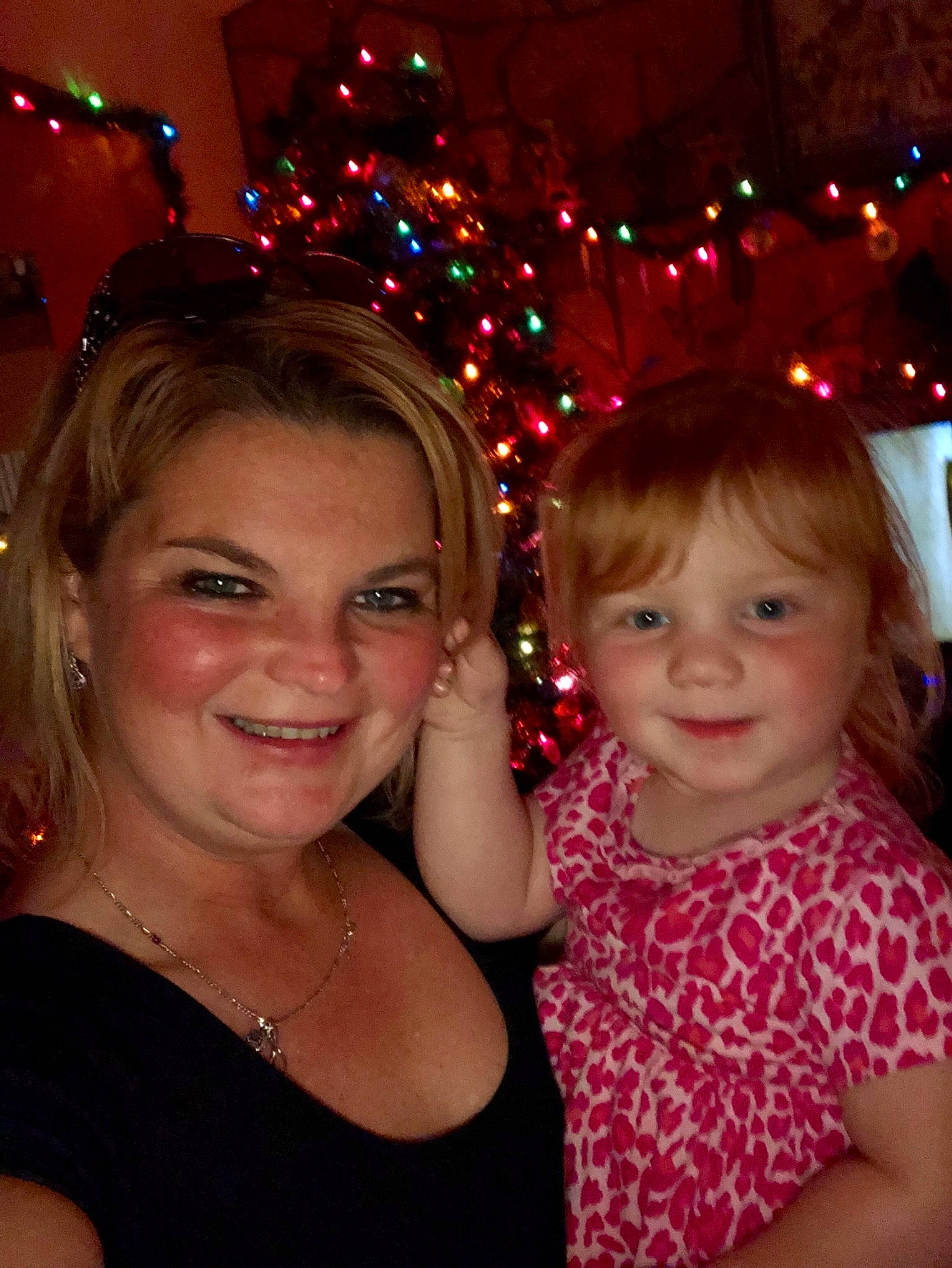 Macayla is registered to the contest to win money with this photo: blond, child, christmas, day, emotion, event, face, facial_expression, fun, girl, hair, head, human_body, human_hair_color, iris, joy, lap, laughter, organ, person