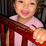 baby, bed, bodypart, cosmetics, crib, face, finger, furniture, hand, handrail, happy, head, infantbed, lipstick, mouth, person, photography, portrait, railing, smile