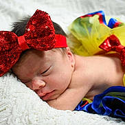 Veronica joined the competition — help win amazing prizes! baby, sleeping, tutu, headband, red_bow, colorful_clothing, blanket, soft_texture, newborn, infant, cute, resting, child, portrait, indoors, closeup, fashion_accessory, skin, peaceful, cozy