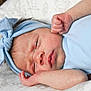 Veronica is registered to the contest to win money with this photo: newborn, baby, infant, headband, blue_clothing, sleepy, close_up, face, hands, blanket, patterned, resting, cute, skin, portrait, baby_girl, indoors, soft_light, sleep, toddler