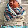 Zion Luciano is registered to the contest to win money with this photo: newborn, baby, infant, sleeping, swaddled, blanket, hat, striped_blanket, portrait, face, eyes_closed, indoors, hospital, bed, text_overlay, name_text, cozy, peaceful, child, photograph