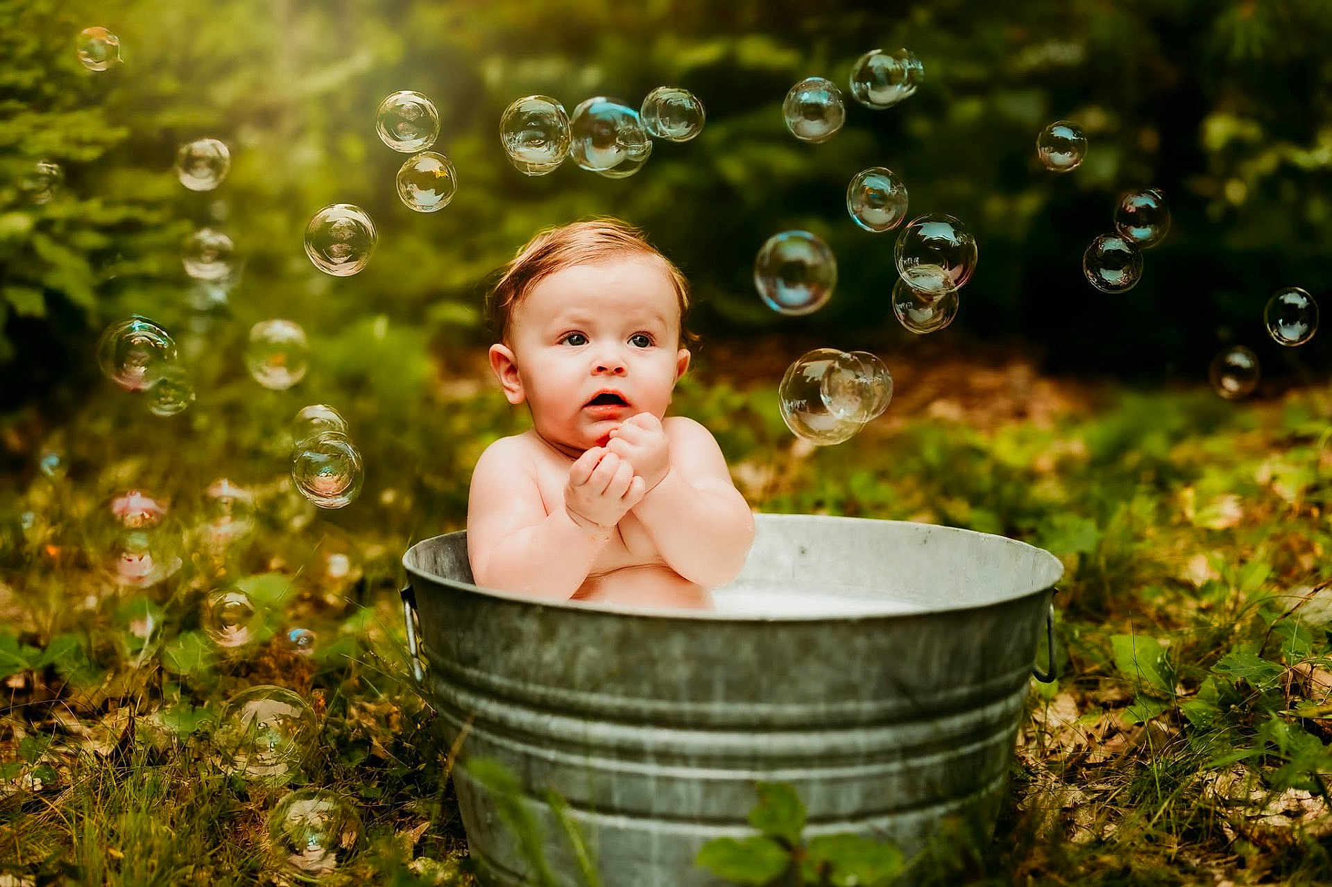 Sawyer is registered to the contest to win money with this photo: baby, child, outdoor, bubbles, metal_tub, nature, grass, greenery, water, cute, infant, summer, playful, skin, expression, toddler, sunlight, garden, fun, portrait