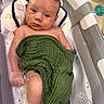baby, infant, child, bathtub, bath, bubbles, towel, green_towel, wet_hair, face, eyes, portrait, indoors, bathroom, soap, pacifier, water, relaxed, sitting, photography