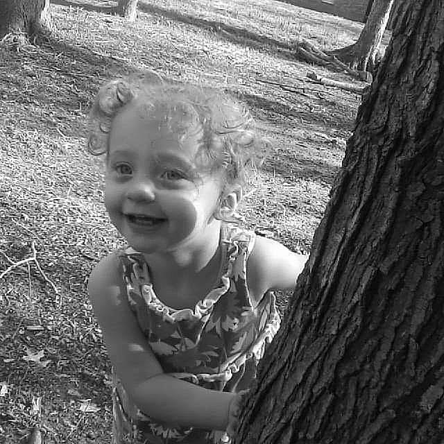 Mikeala joined the competition — help win amazing prizes! baby, baby_laughing, baby_toddler_clothing, black, black_and_white, child, eye, flash_photography, fun, grass, happy, iris, joy, monochrome, monochrome_photography, people_in_nature, person, smile, toddler, trunk