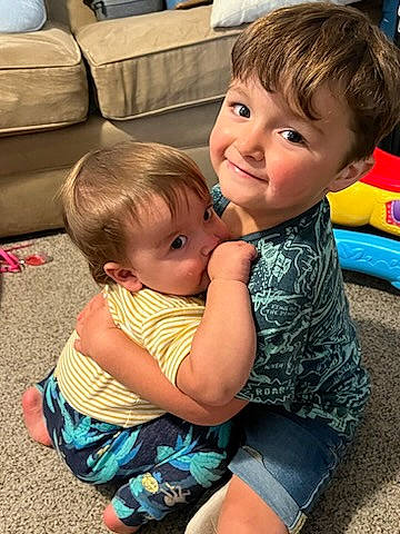 Silas is registered to the contest to win money with this photo: baby_toddler_clothing, blue, cheek, child, eye, fun, grass, hair, hairstyle, happy, head, iris, leisure, person, shorts, skin, smile, summer, thigh, toddler