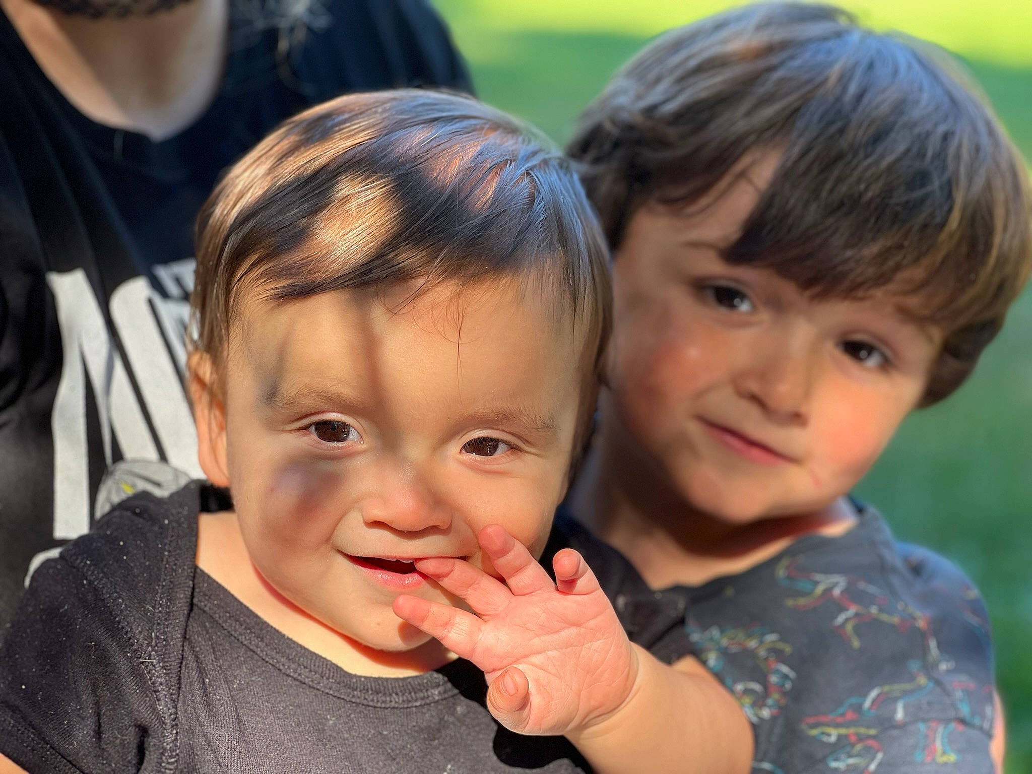 Finn is registered to the contest to win money with this photo: baby, cheek, child, event, face, fun, gesture, grass, happy, iris, laugh, leisure, people_in_nature, person, recreation, sharing, skin, smile, thumb, toddler