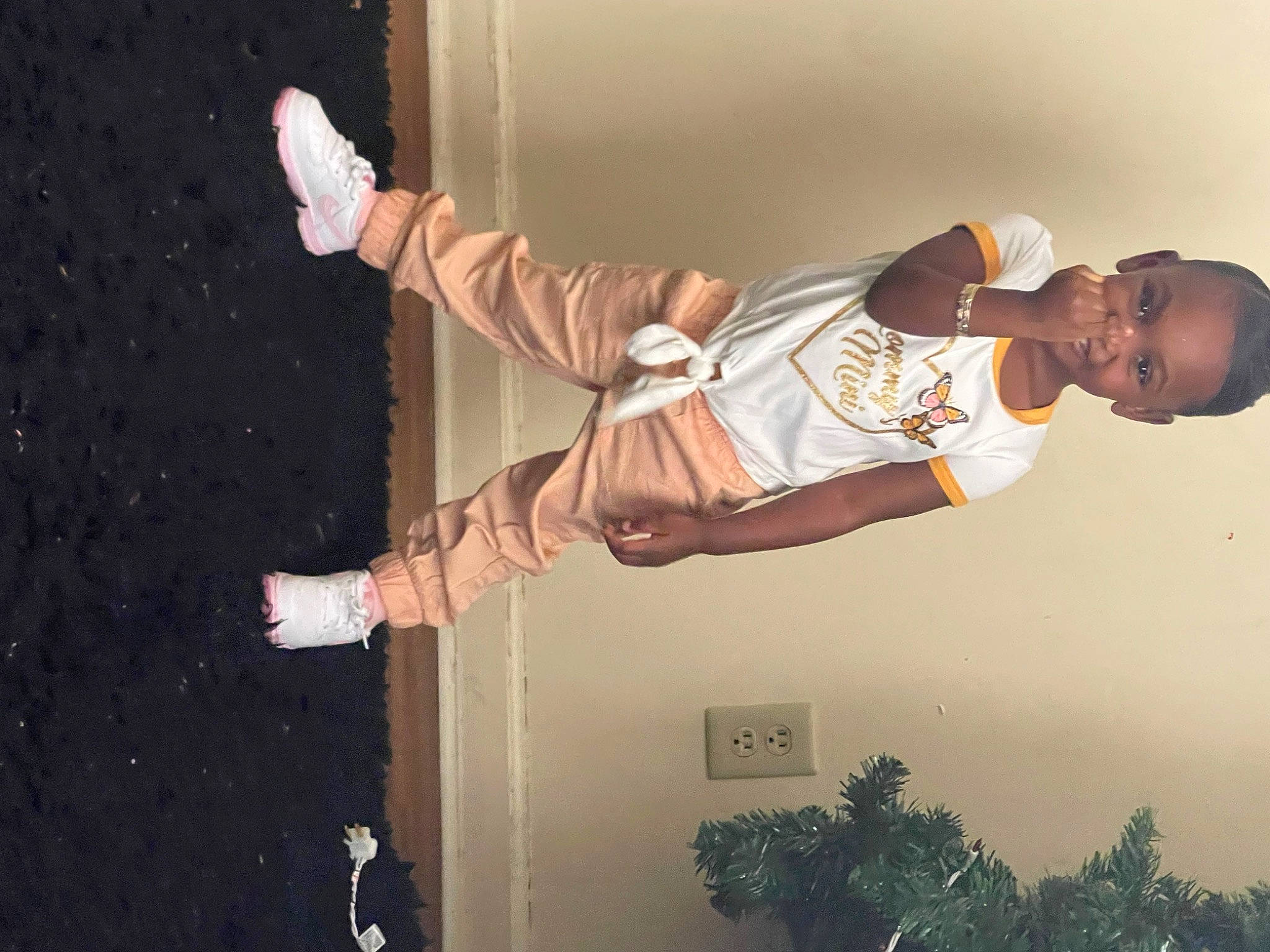 Ja'Niyah joined the competition — help win amazing prizes! arm, ceiling, elbow, entertainment, event, flash_photography, fun, gesture, happy, leg, performance, performing_arts, person, plant, t_shirt, thigh, tree