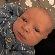 Everett is registered to the contest to win money with this photo: baby, baby_garment, blue_clothing, closeup, cloud_pattern, cozy, cushion, expression, eyes, face, head, indoor, infant, newborn, person, portrait, resting, skin, soft_texture, striped_clothing