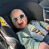 Maël a rejoint le concours — aidez-le/la à gagner de superbes lots ! accessory, baby, car_interior, car_seat, cheeks, child, close_up, cute, hand, happy, harness, infant, outfit, portrait, reflection, seat_belt, smile, sunglasses, sunlight, teeth