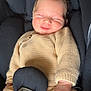 baby, car_seat, child, clothing, comfort, cute, fingers, happy, indoors, infant, knitted_sweater, portrait, resting, safety, seat, seatbelt, smile, soft_toys, yellow_socks, young