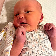 Charlotte is registered to the contest to win money with this photo: baby, blanket, bodypart, face, finger, hand, head, newborn, person, photography, portrait, quilt, sleeping, wrist
