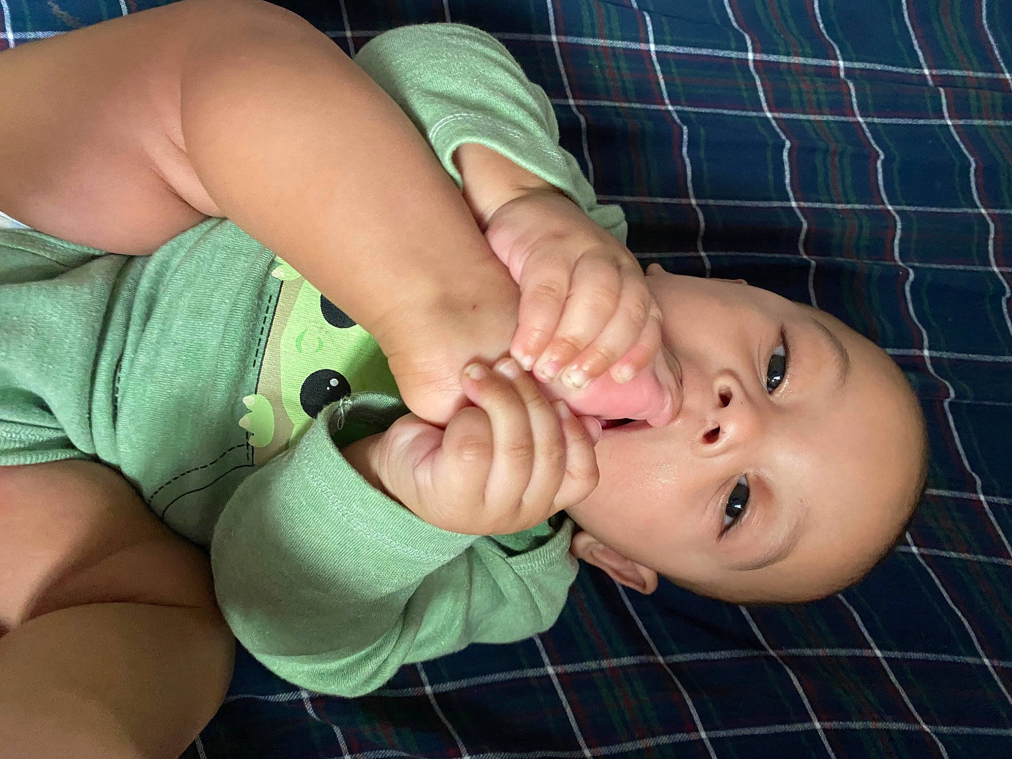 Jamal joined the competition — help win amazing prizes! baby, baby_toddler_clothing, blue, cheek, elbow, eyelash, finger, gesture, grass, joint, lip, mouth, nail, neck, nose, person, skin, sleeve, tartan, thumb