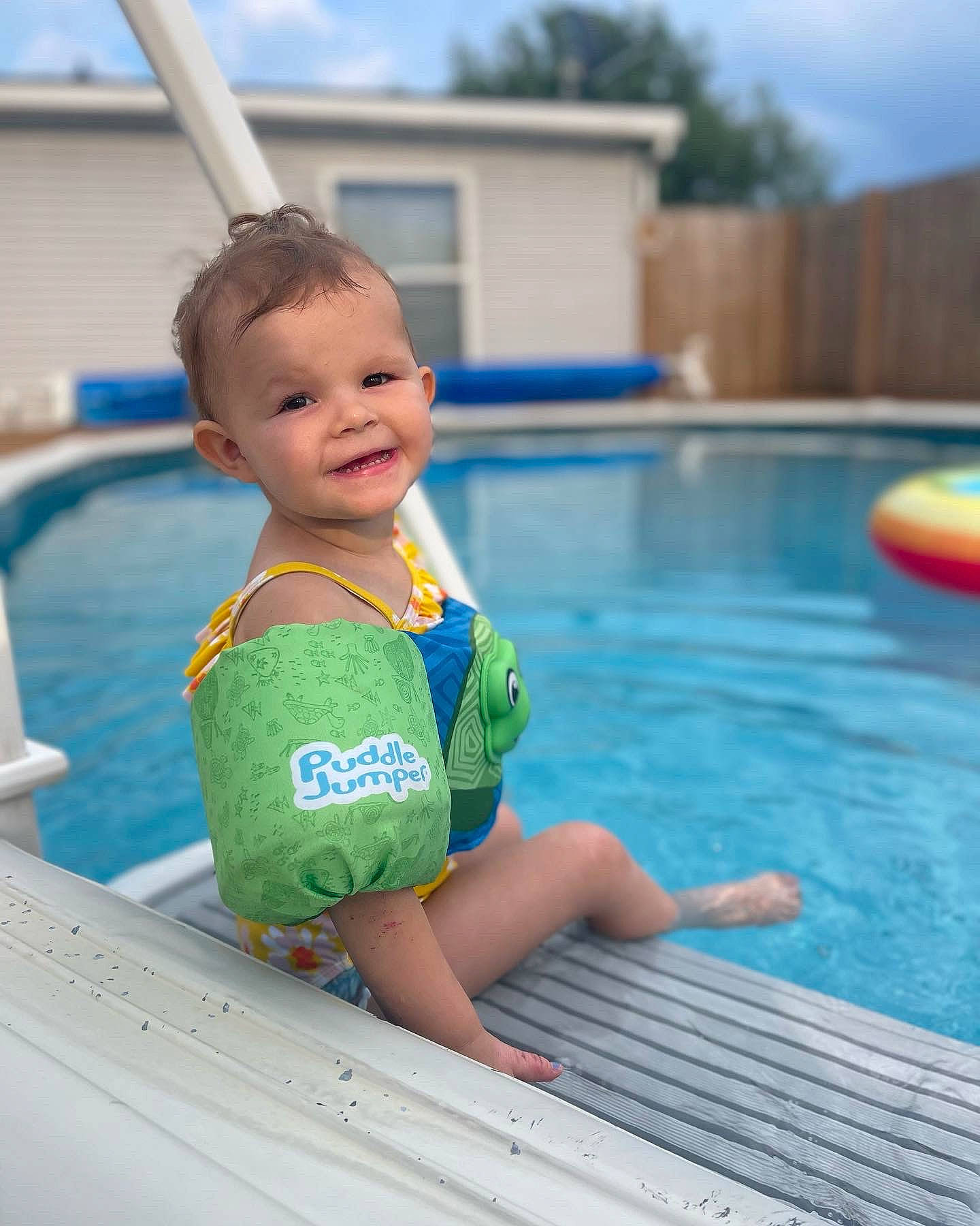 Maylie is registered to the contest to win money with this photo: aqua, azure, baby, baby_toddler_clothing, blue, body_of_water, child, cloud, fun, happy, joy, leisure, outdoor_recreation, person, play, recreation, sky, smile, summer, swimming_pool