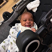 Onyx joined the competition — help win amazing prizes! baby, baby_accessory, baby_cart, baby_garment, child, clothing, cute, fabric, face, happy, indoor, infant, joy, onesie, person, seat, smiling, sock, stroller, toy
