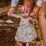baby, child, pink_bow, floral_dress, holding_hands, legs, water, stream, outdoor, nature, adult, shorts, sandals, feet, rock, grass, summer, cute, support, exploration