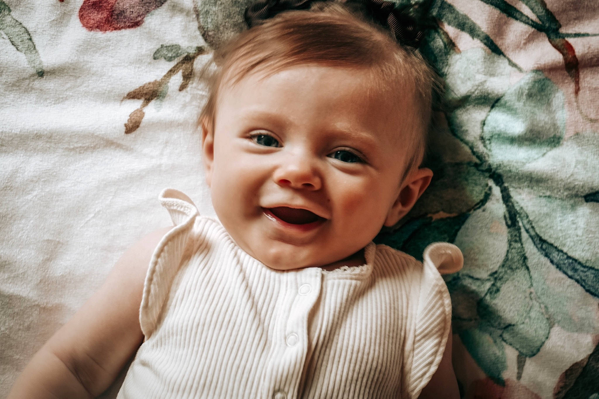 Kendall is registered to the contest to win money with this photo: baby, baby_toddler_clothing, cheek, chin, eye, flash_photography, hairstyle, happy, head, iris, lip, mouth, nose, people_in_nature, person, plant, skin, smile, standing, textile