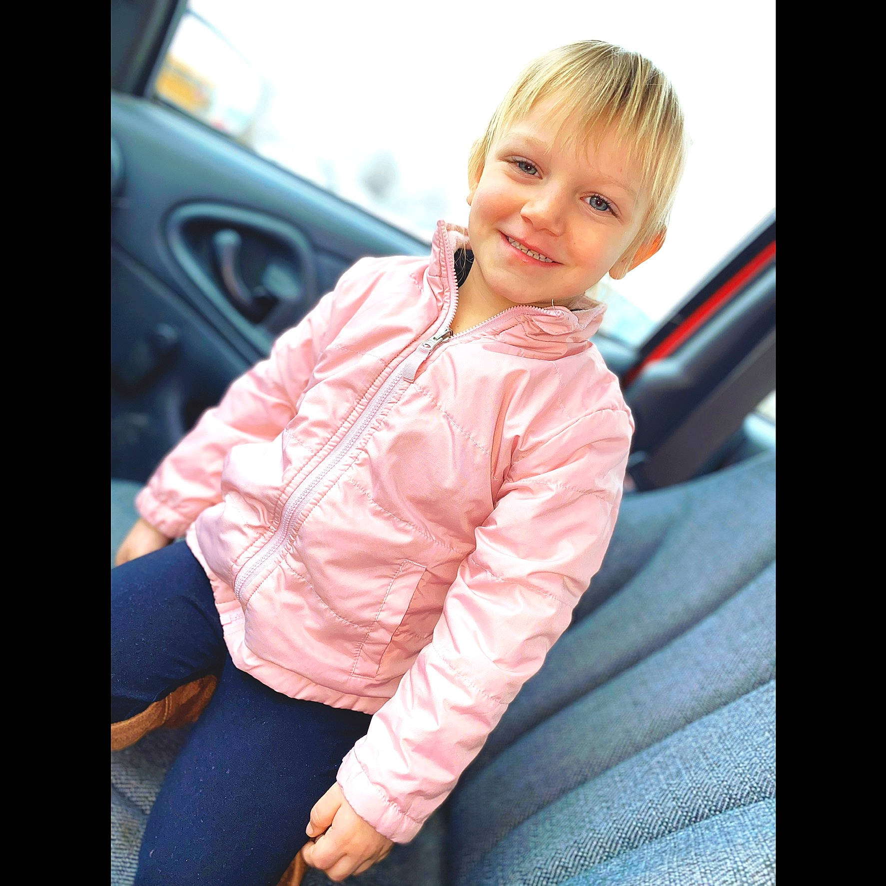 Haley is registered to the contest to win money with this photo: baby, beauty, blond, cheek, child, child_model, cool, face, hair, hairstyle, hand, jacket, joy, outerwear, person, photography, sitting, skin, sleeve, smile