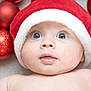 Rowan joined the competition — help win amazing prizes! baby, face, santa_hat, christmas_ornaments, red, white, blue_eyes, holiday, festive, cute, infant, closeup, skin, expression, cheeks, mouth, background, decorations, celebration, portrait