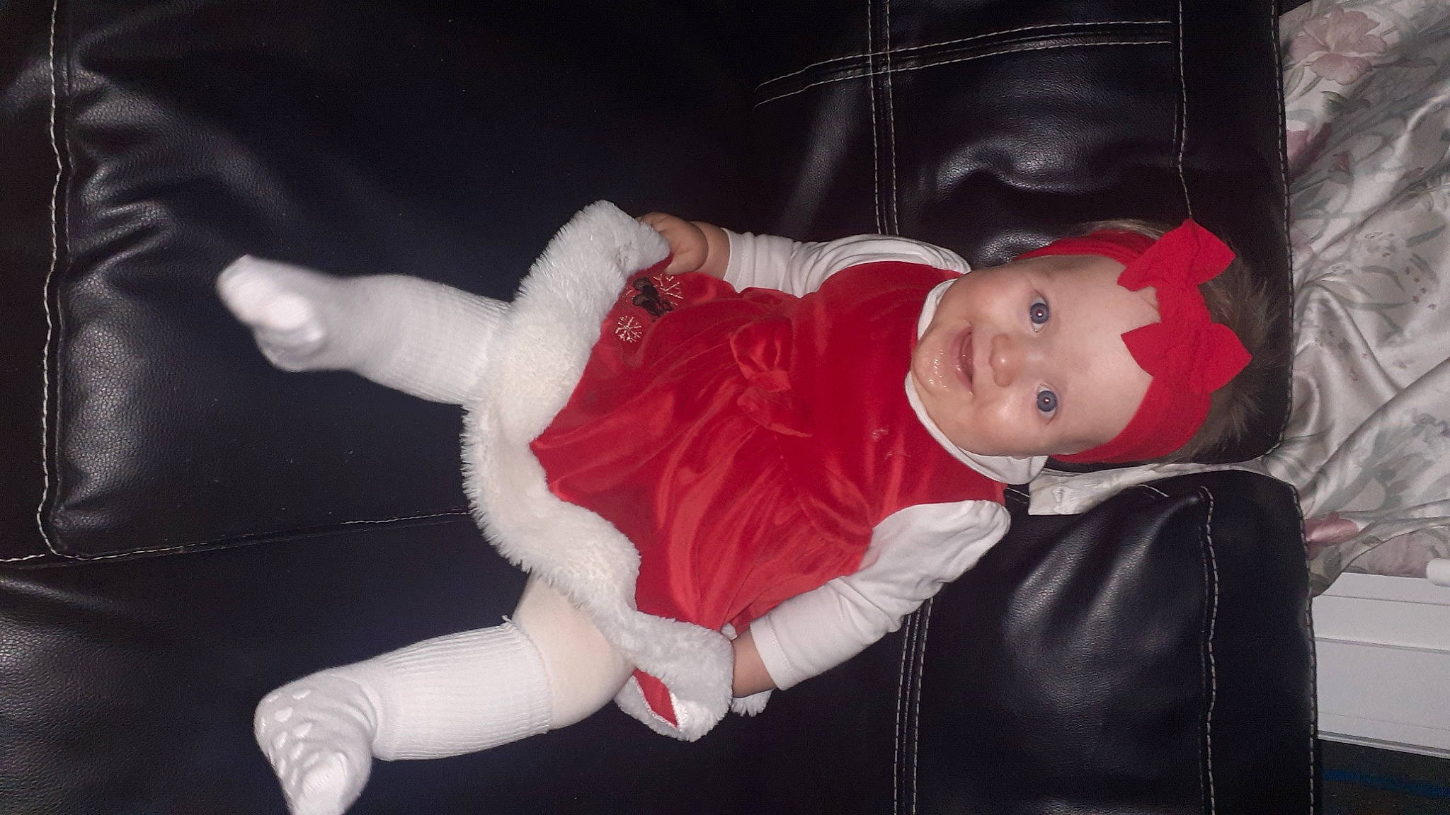 Freya participe au concours pour gagner de l'argent avec cette photo : baby, baby_toddler_clothing, carmine, cheek, child, christmas_eve, comfort, costume, event, fun, fur, fur_clothing, headwear, human_body, joy, lap, person, sitting, sleeve, textile