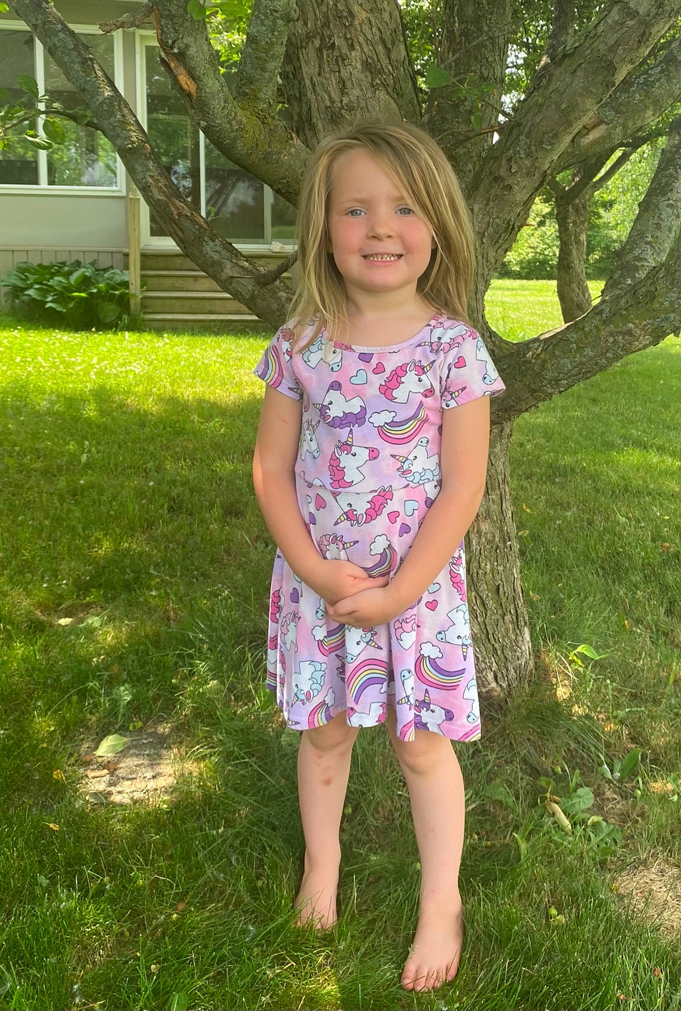 Kara is registered to the contest to win money with this photo: day_dress, dress, fawn, grass, green, happy, human_body, joy, leaf, leisure, meadow, people_in_nature, person, pink, plant, shoulder, sleeve, smile, standing, sunlight