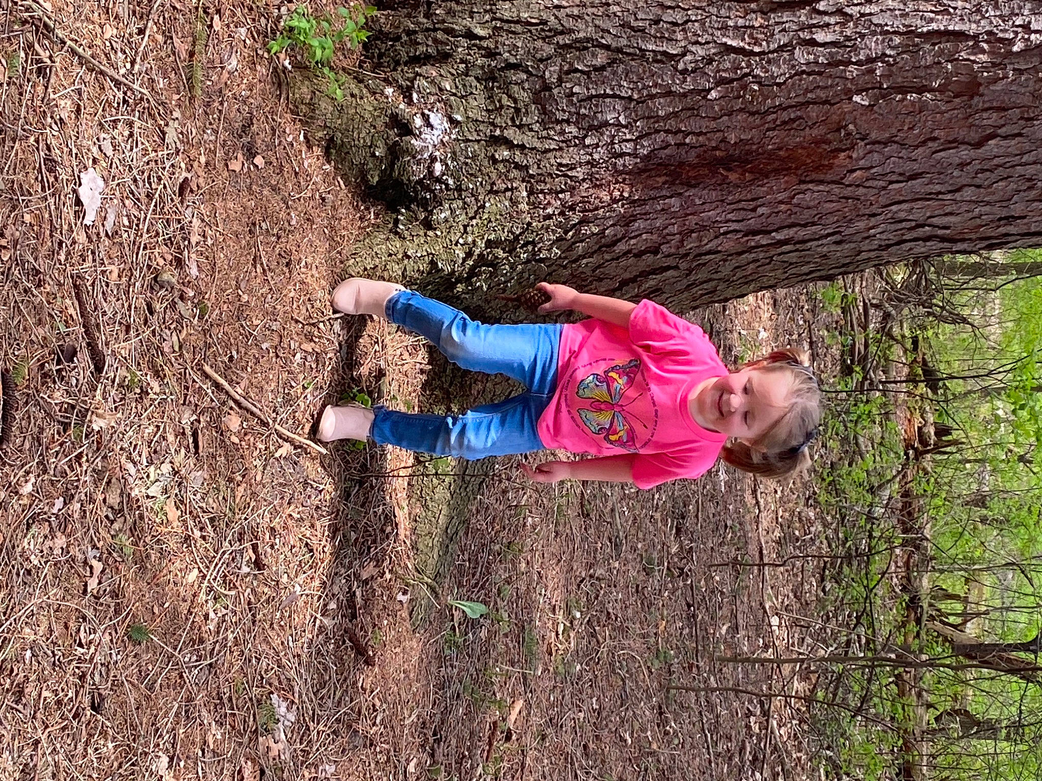 Kara is registered to the contest to win money with this photo: baby_toddler_clothing, branch, grass, grass_family, joy, landscape, leaf, leisure, mammal, nature, organism, people_in_nature, person, plant, recreation, smile, soil, toddler, tree, trunk