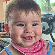 Charlie participe au concours pour gagner de l'argent avec cette photo : baby, bib, blue, cheeks, child, closeup, clothing, cute, eyes, face, happy, head, indoor, infant, mouth, person, pink, portrait, smiling, young