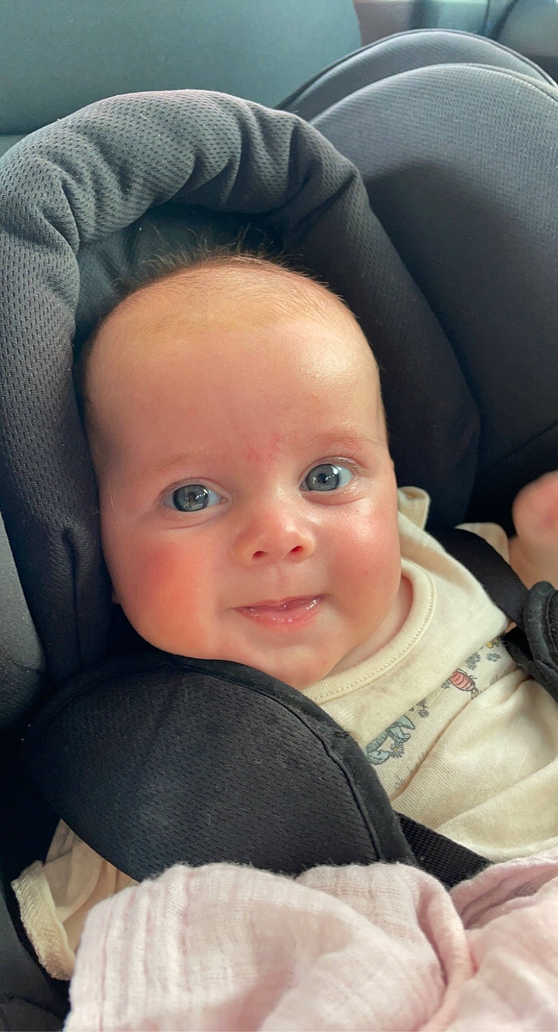 Marlee is registered to the contest to win money with this photo: baby, baby_carriage, baby_in_car_seat, baby_toddler_clothing, cheek, chin, comfort, cool, eye, eyebrow, finger, head, mouth, nose, person, product, seat_belt, skin, smile, textile