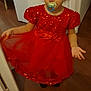 Siloë a rejoint le concours — aidez-le/la à gagner de superbes lots ! child, girl, red_dress, pacifier, indoor, floor, door, curly_hair, standing, pose, sequins, tulle, flowers, expression, young_child, cute, person, head, face, clothing