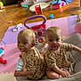 baby, toddler, pacifier, matching_clothing, leopard_print, baby_rocker, playroom, foam_mats, toys, floor, indoor, child, sitting, back_to_back, cute, infant, play, pink, purple, blanket