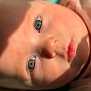 Kj joined the competition — help win amazing prizes! baby, close_up, face, eyes, infant, skin, lips, portrait, child, newborn, soft_light, shadow, cute, expression, head, lying_down, warm_tone, young, person, natural_light