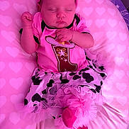 Ysabella is registered to the contest to win money with this photo: baby, blanket, bow, closed_eyes, costume, cushion, cute, dress, fashion, hearts, indoors, infant, lying_down, nursery, peaceful, photography, pink, portrait, sleeping, tutu