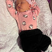 Ysabella joined the competition — help win amazing prizes! baby, black_pants, blanket, child, cozy, cute, headband, hello_kitty, indoors, infant, peaceful, pink_clothing, portrait, quilted, resting, sleep, sleeping, soft_lighting, toddler, white_socks