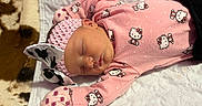 Ysabella is registered to the contest to win money with this photo: apparel, baby, blanket, bow, child, cute, fur, headband, hello_kitty, indoors, infant, newborn, peaceful, pink_clothing, portrait, quilted, resting, sleep, sleeping, soft_texture