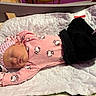 Ysabella is registered to the contest to win money with this photo: baby, blanket, bow, child, clothing, crib, cute, fabric, headband, hello_kitty, indoor, infant, newborn, pajamas, peaceful, person, pink, resting, sleeping, soft