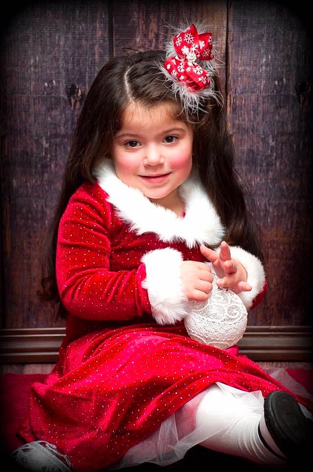 Daniella is registered to the contest to win money with this photo: baby_toddler_clothing, child_model, costume, costume_accessory, embellishment, fur, fur_clothing, hair_accessory, headband, headgear, headpiece, human_body, joy, lap, natural_material, person, photo_shoot, pink, portrait_photography, sitting